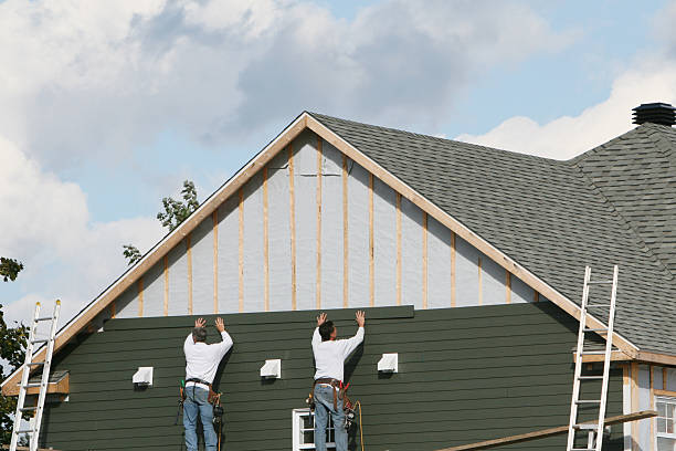 Professional Siding technician working in Wellesley Hills, MA